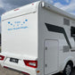 Adesivo sticker camper frase frasi CASA È DOVE LA PARCHEGGI -caravan roulotte- accessori grafiche fiancata scegli colore cod. 0426 (cm 56 x 25)